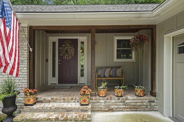 7265 Hunters Branch Dr, Sandy Springs, GA 30328 - doorway to property with roof with shingles, board and batten siding, and covered porch