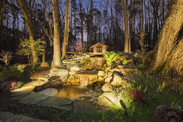 7265 Hunters Branch Dr, Sandy Springs, GA 30328 - view of yard with a garden pond