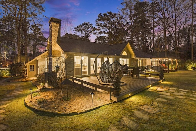 7265 Hunters Branch Dr, Sandy Springs, GA 30328 - rear view of house featuring a deck, a chimney, and stone siding