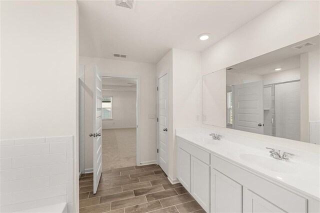 bathroom with sink and wood-type flooring