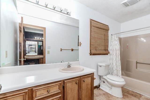 750 Jett Roberts Rd, Jefferson, GA 30549 - bathroom featuring toilet, vanity, shower / bath combo, tile patterned floors, and a textured ceiling