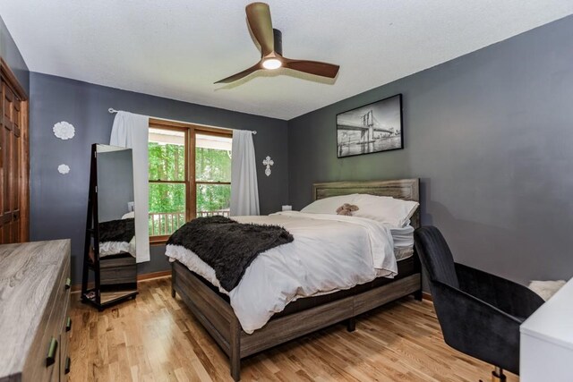 750 Jett Roberts Rd, Jefferson, GA 30549 - bedroom with light wood-style floors, a ceiling fan, and baseboards