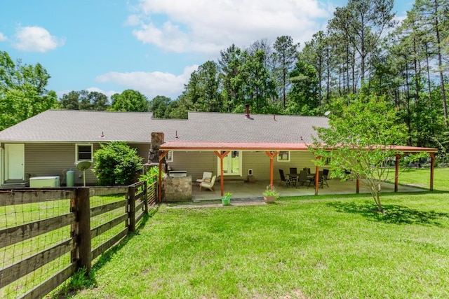 750 Jett Roberts Rd, Jefferson, GA 30549 - rear view of house featuring roof with shingles and a patio area