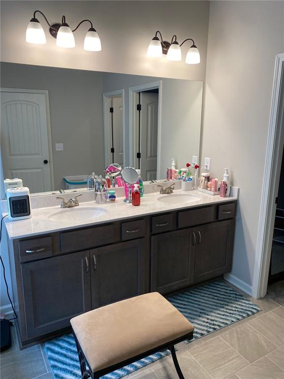 115 Harmony Farms Dr, Eatonton, GA 31024 - full bathroom with double vanity and tile patterned flooring