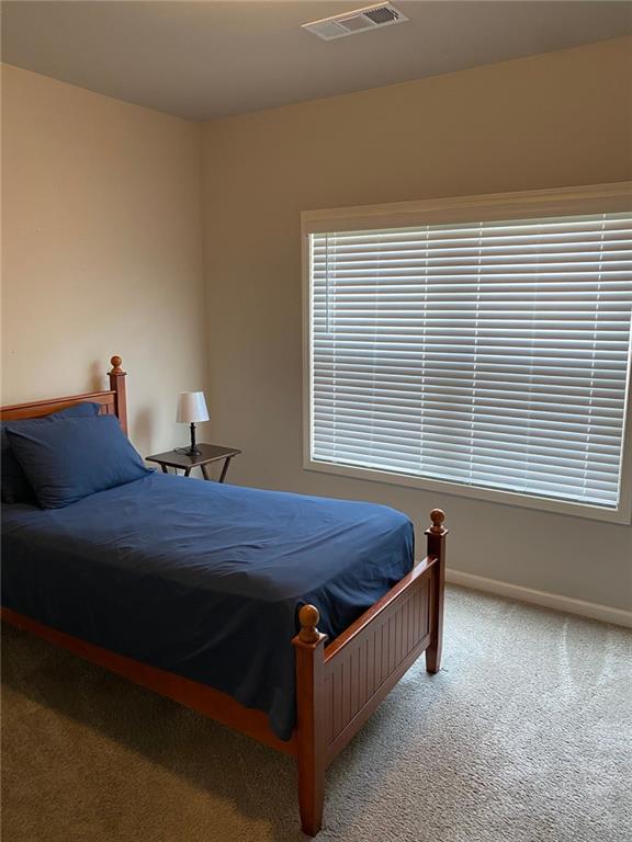 115 Harmony Farms Dr, Eatonton, GA 31024 - carpeted bedroom featuring baseboards