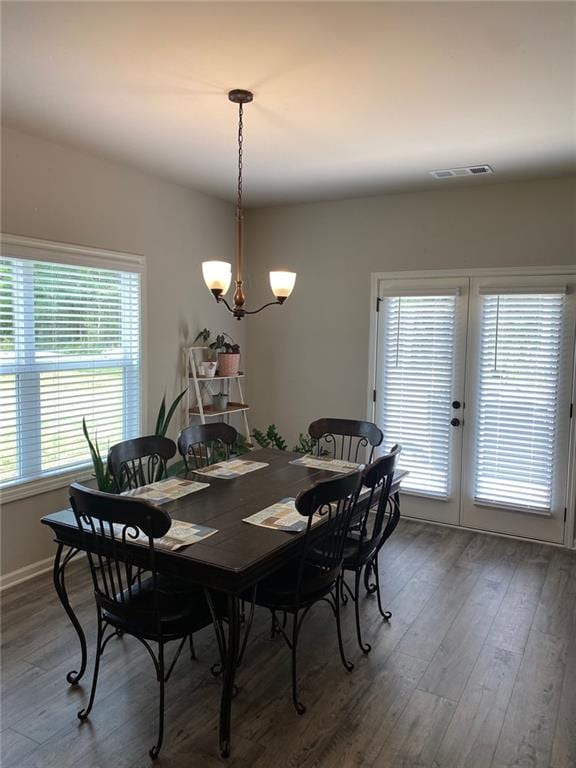 115 Harmony Farms Dr, Eatonton, GA 31024 - dining room with wood finished floors, french doors, and a chandelier