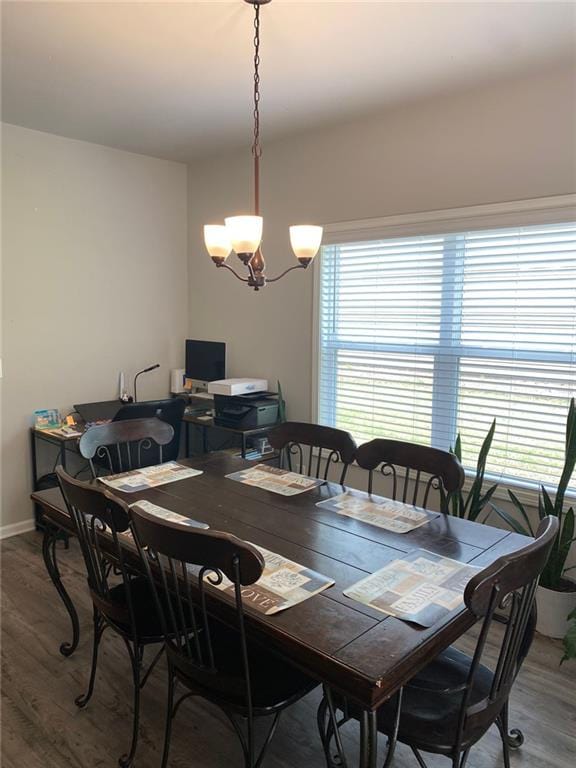 115 Harmony Farms Dr, Eatonton, GA 31024 - dining room with wood finished floors and a chandelier