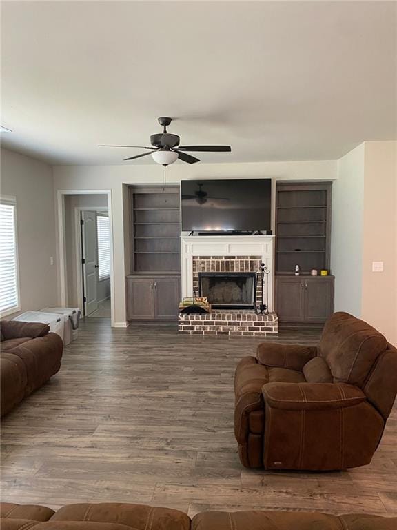 115 Harmony Farms Dr, Eatonton, GA 31024 - living room with a ceiling fan, wood finished floors, and a brick fireplace