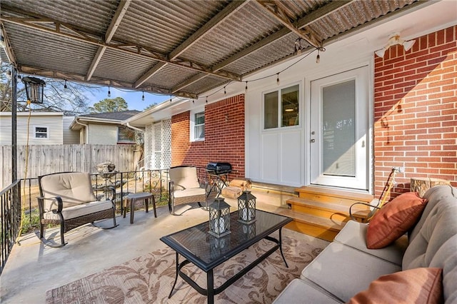 view of patio / terrace with fence and an outdoor hangout area