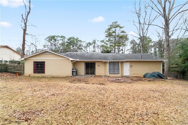 back of property with fence