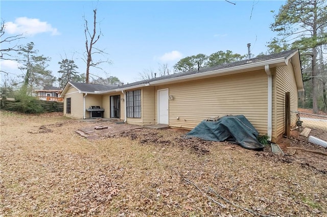 back of house with fence