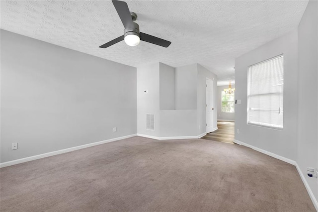 800 Tradd Ct, Stone Mountain, GA 30087 - carpeted spare room featuring a chandelier, a textured ceiling, and a ceiling fan
