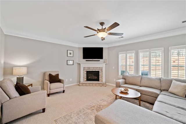 living room featuring ceiling fan, light colored carpet, ornamental molding, and a fireplace