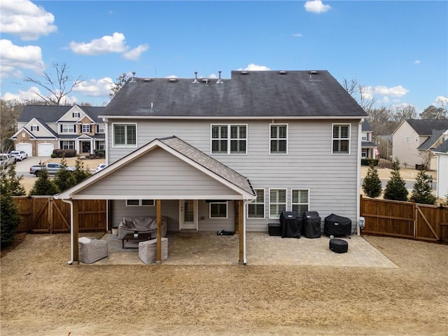 rear view of house with a patio