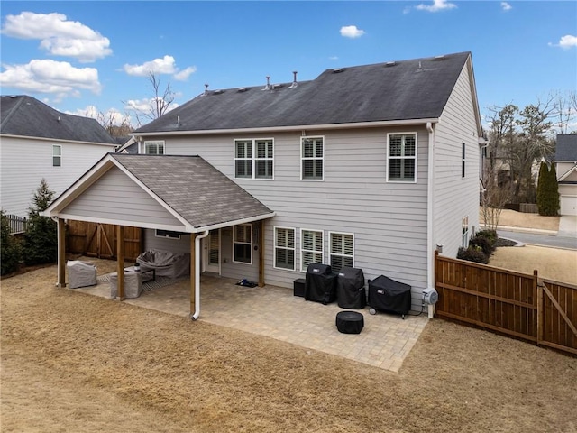 back of house with a patio