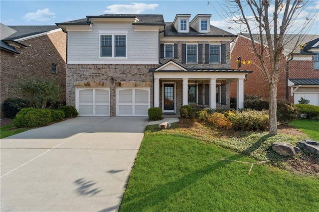 view of front of property with covered porch, a front yard, and a garage