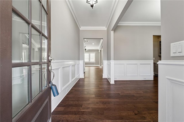 corridor with dark hardwood / wood-style flooring and ornamental molding