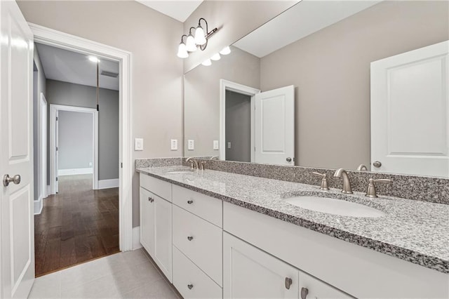 bathroom featuring tile patterned flooring and vanity