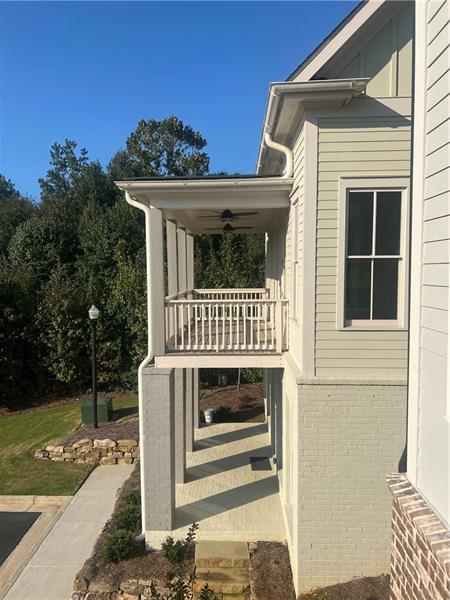 exterior space featuring ceiling fan