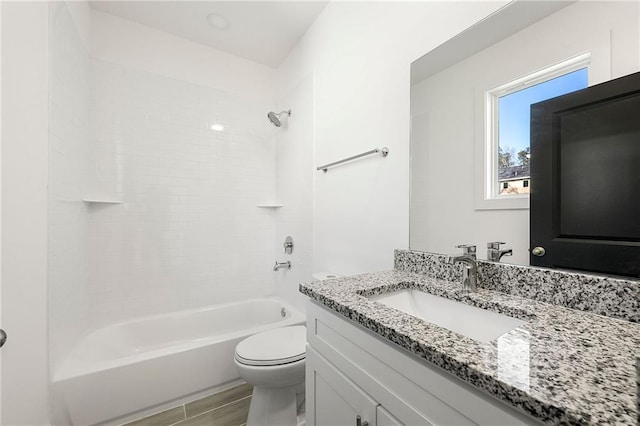 full bathroom with vanity,  shower combination, and toilet