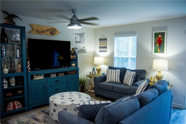 living room with ceiling fan and dark wood-type flooring