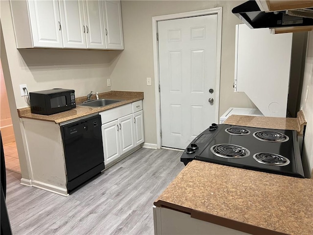 kitchen featuring ventilation hood, black appliances, sink, light wood-type flooring, and white cabinetry