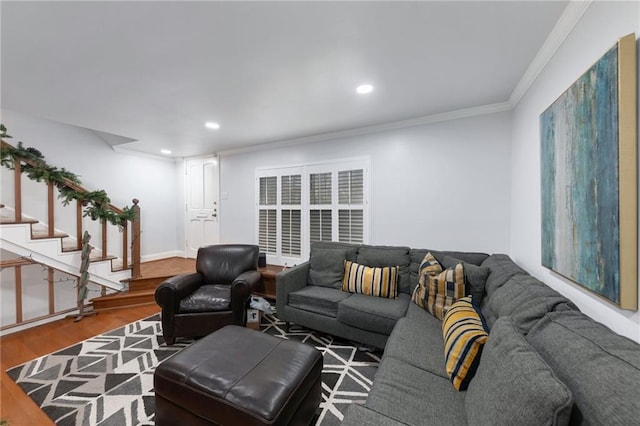 living room with hardwood / wood-style flooring and crown molding