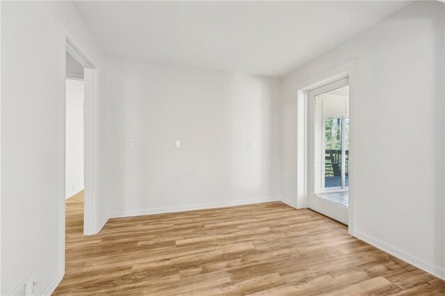 washroom with light tile patterned flooring, cabinets, hookup for an electric dryer, and washer hookup