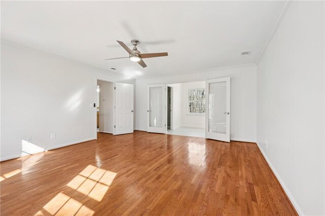 unfurnished room featuring light wood-type flooring and plenty of natural light