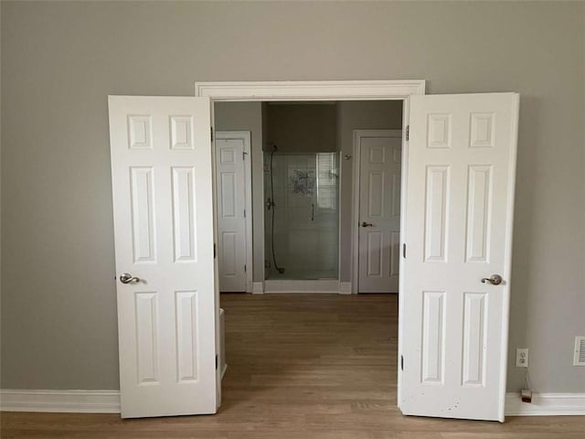 corridor featuring hardwood / wood-style flooring