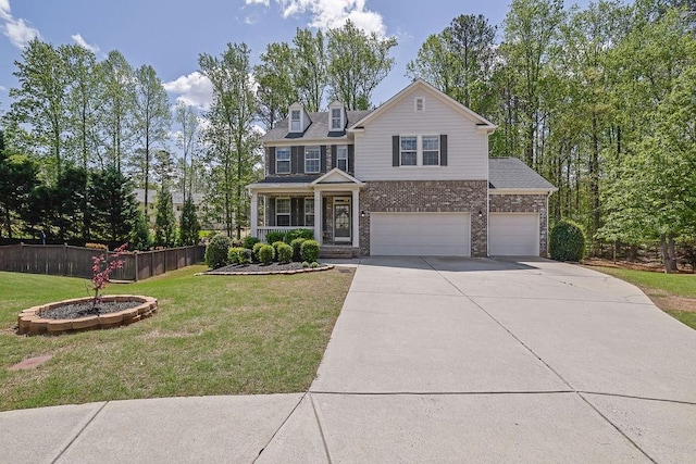 view of front of property featuring a front yard, a garage, fence, concrete driveway, and brick siding