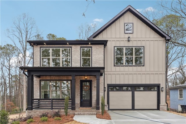 modern inspired farmhouse with a garage