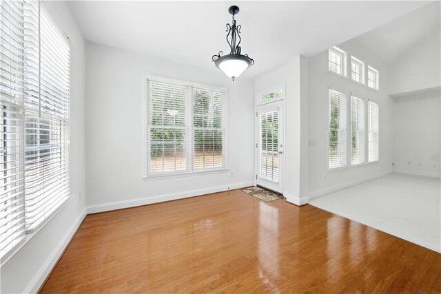 12554 Huntington Trce, Alpharetta, GA 30005 - unfurnished dining area featuring wood finished floors and baseboards