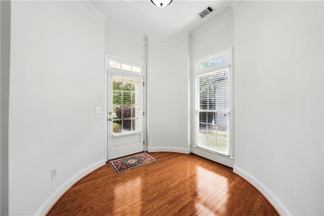 12554 Huntington Trce, Alpharetta, GA 30005 - doorway to outside featuring wood finished floors, ornamental molding, and baseboards