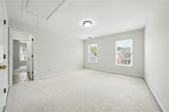 12554 Huntington Trce, Alpharetta, GA 30005 - unfurnished room with attic access, plenty of natural light, and light carpet