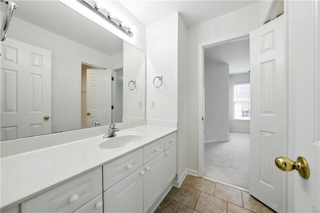 12554 Huntington Trce, Alpharetta, GA 30005 - bathroom with vanity and baseboards