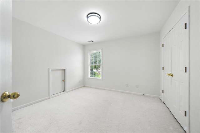 12554 Huntington Trce, Alpharetta, GA 30005 - unfurnished bedroom featuring carpet, baseboards, and a closet