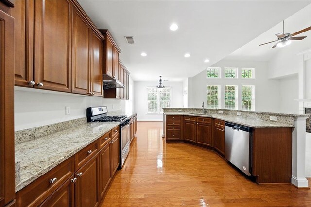 12554 Huntington Trce, Alpharetta, GA 30005 - kitchen with appliances with stainless steel finishes, light wood-type flooring, a sink, under cabinet range hood, and a ceiling fan