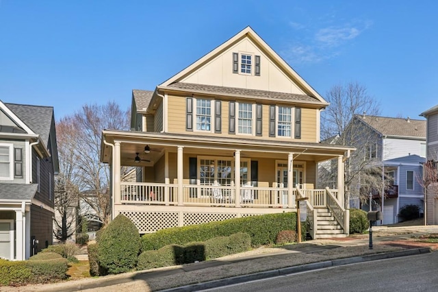 view of front facade with a porch, a shingled roof, and a ceiling fan