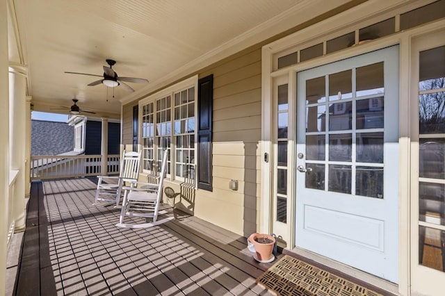 deck with a porch and a ceiling fan