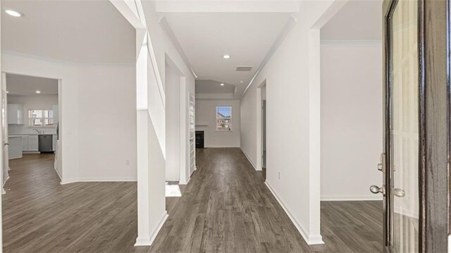 1149 Blue Juniper Cir, Loganville, GA 30052 - corridor with ornamental molding, plenty of natural light, dark wood finished floors, baseboards, and recessed lighting