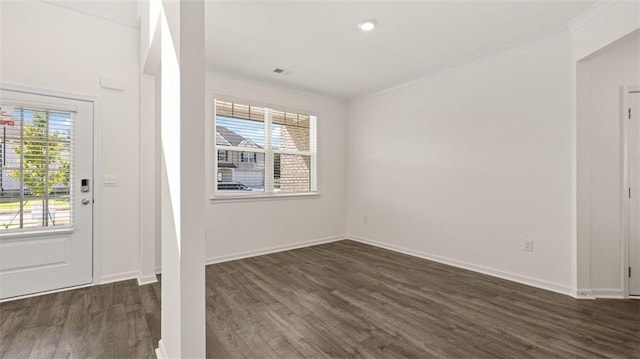 1149 Blue Juniper Cir, Loganville, GA 30052 - foyer featuring crown molding, dark wood-style flooring, plenty of natural light, and baseboards