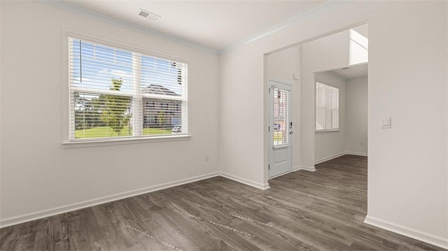 1149 Blue Juniper Cir, Loganville, GA 30052 - empty room featuring crown molding, dark wood finished floors, and baseboards