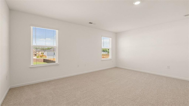 1149 Blue Juniper Cir, Loganville, GA 30052 - unfurnished room featuring light colored carpet, baseboards, and recessed lighting