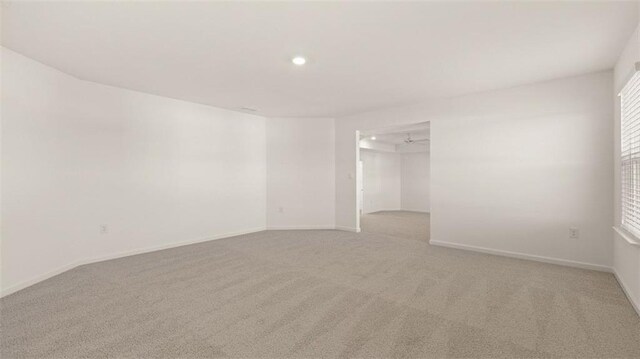 1149 Blue Juniper Cir, Loganville, GA 30052 - spare room featuring light colored carpet, recessed lighting, and baseboards