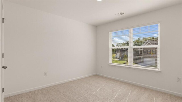 1149 Blue Juniper Cir, Loganville, GA 30052 - spare room with light colored carpet and baseboards