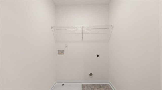 1149 Blue Juniper Cir, Loganville, GA 30052 - laundry area featuring electric dryer hookup, washer hookup, and baseboards