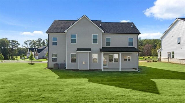 1149 Blue Juniper Cir, Loganville, GA 30052 - rear view of property featuring a yard, a patio, and central air condition unit