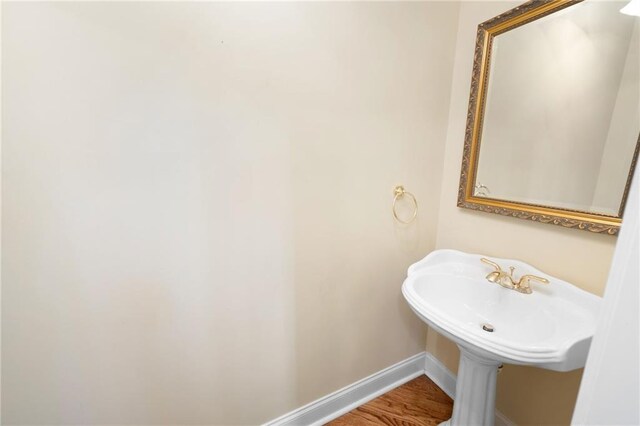 223 Oak Grove Dr, Dallas, GA 30157 - bathroom with baseboards and wood finished floors