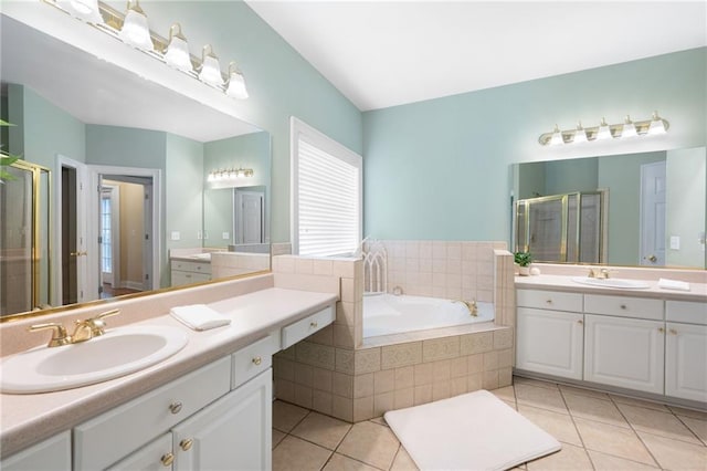 223 Oak Grove Dr, Dallas, GA 30157 - full bathroom featuring two vanities, a shower stall, a bath, and tile patterned flooring